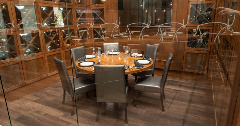 Interior, set round table and black leather chairs