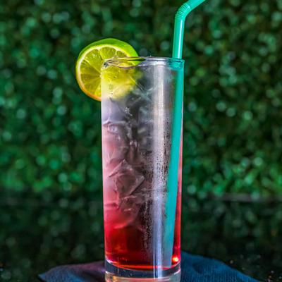 Watermelon Island cocktail with lime wheel.