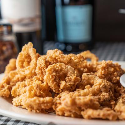Fried calamari with marinara sauce on the side.