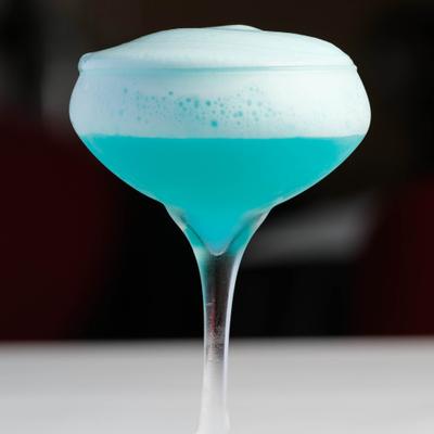 Blue cocktail in the glass.