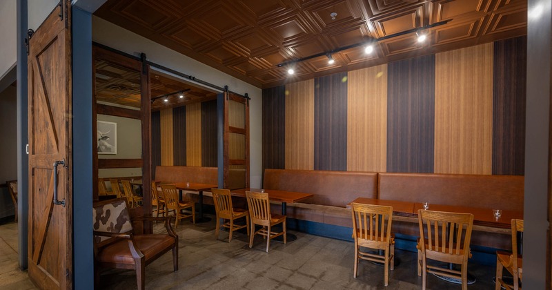 Interior, private tables separated by wooden doors