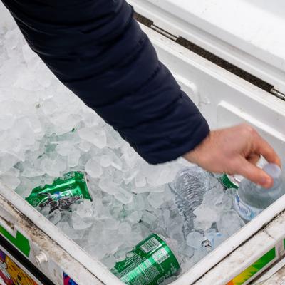 Taking juice from the ice chest.
