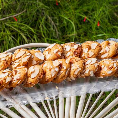 Almond cookies on an outdoor table.