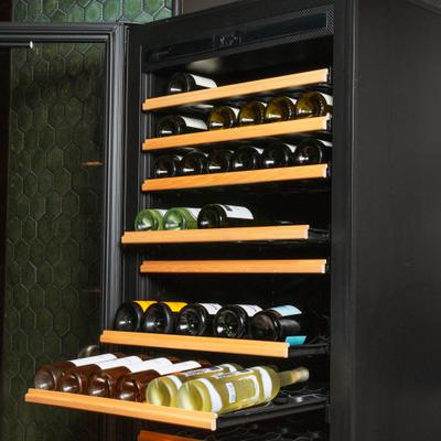 Wine bottles on the rack.