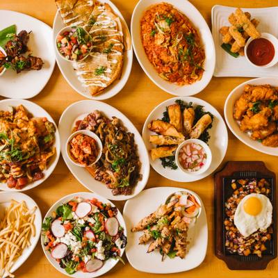 Variety of plated dishes arranged on table.