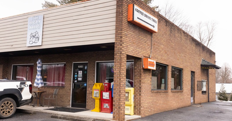 Exterior, front view to restaurant entrance, sign above