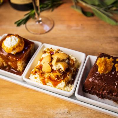 Apple Spice Cake, Banana Pudding, Flourless Chocolate Tort, all served