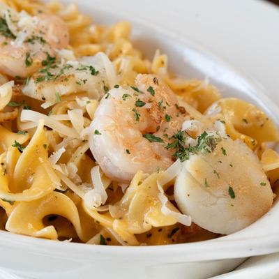 Shrimp and Scallops in white wine and lobster sauce served with Greek egg noodles.