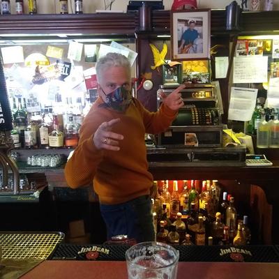 A staff member behind the bar.