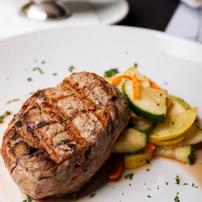 Filet mignon steak with mixed vegetables.