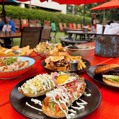 Various dishes served on an outdoor table.