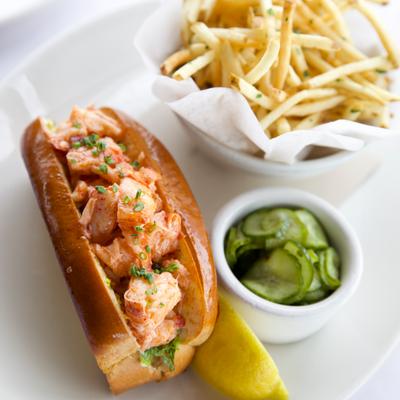 Image of the lobster roll, pickles and fries!.