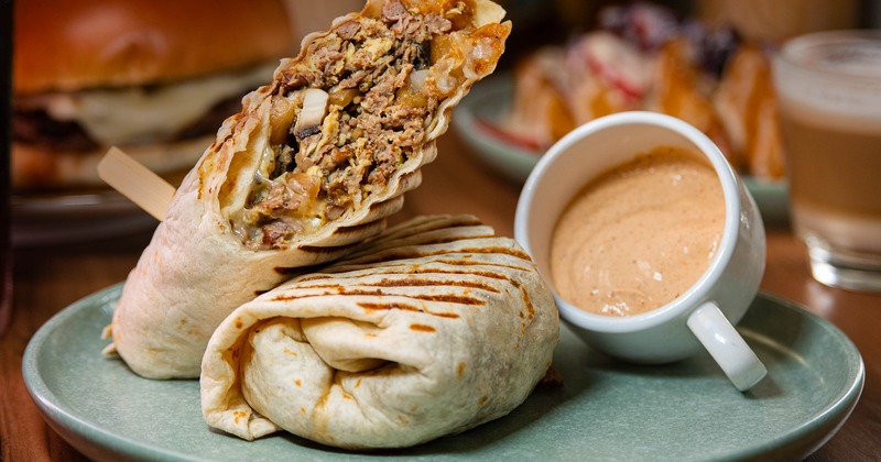 Steak Burrito with sauce for dipping