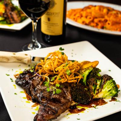 Grilled ribeye with crispy onions and broccoli.