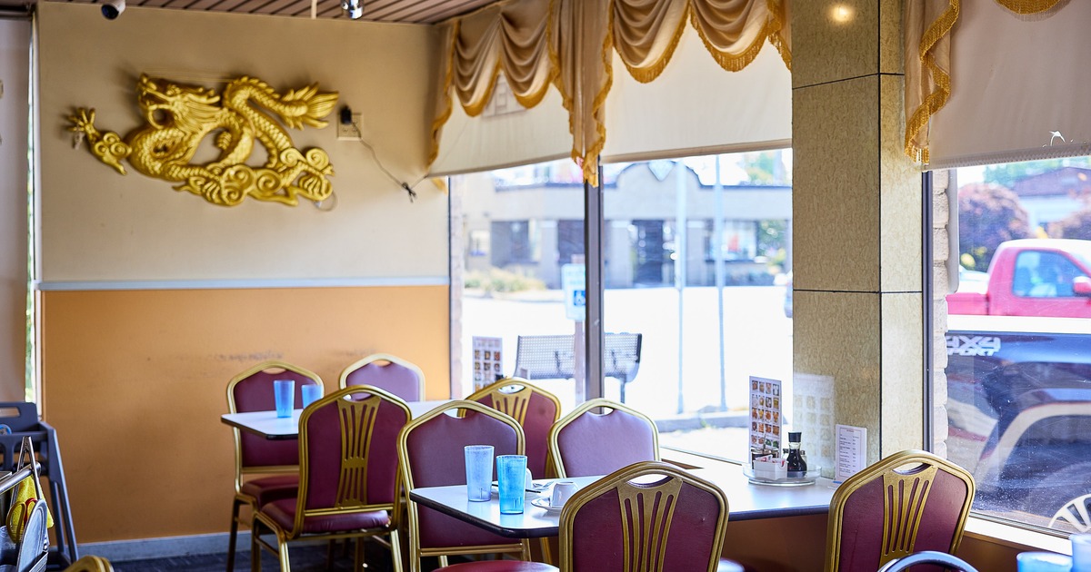 Chinese restaurant interior dining area with dining tables along windows
