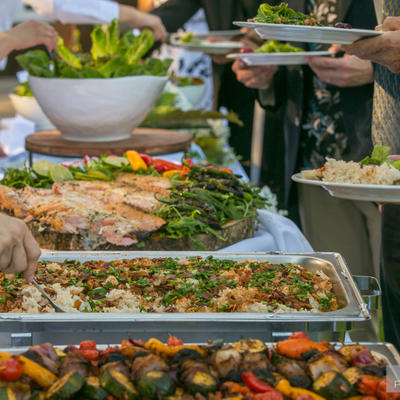 Three dishes and salad ready for service
