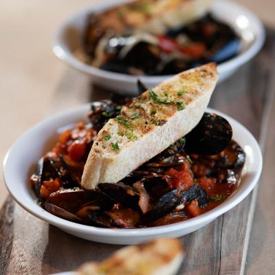 Mussels with a slice of baguette