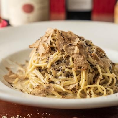 Truffle tagliolini topped with shaved truffles.