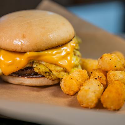 Breakfast sandwich and tater tots.