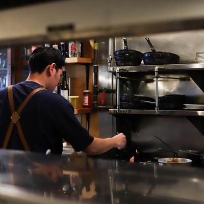 A cook preparing food.