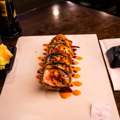 Sushi rolls with tuna, cream cheese, avocado, and crab sticks.