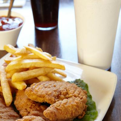 Fried fish and fries accompanied with a milkshake.
