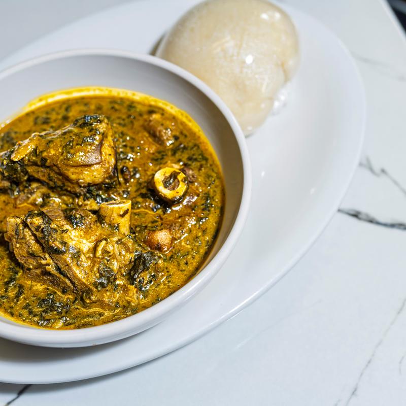 Bitter leave soup(Ofe Onugbu) served with goat meat photo