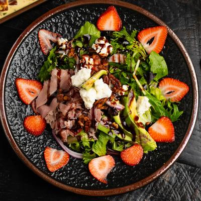 Served salad with berries