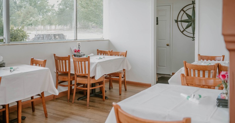 Interior, tables and chairs ready for guests
