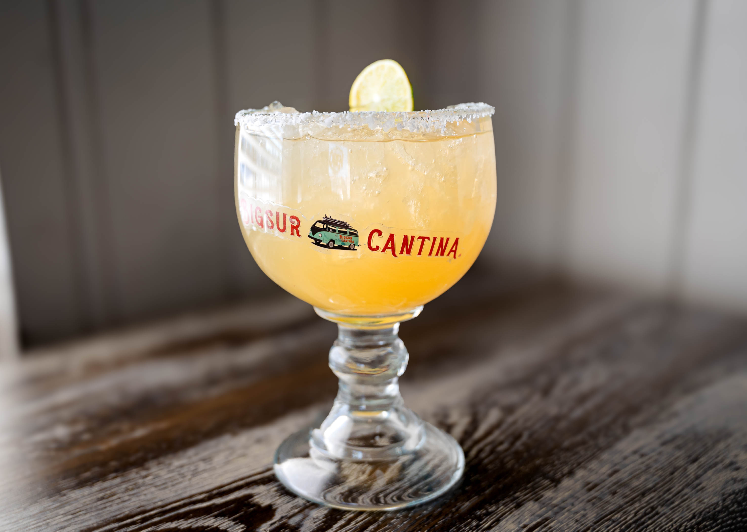 House margarita served in a glass with salted rim
