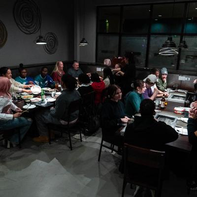 Group of people dining in a restaurant, indoors.