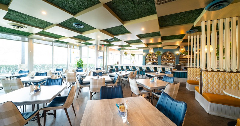 Interior, tables and chairs ready for guests