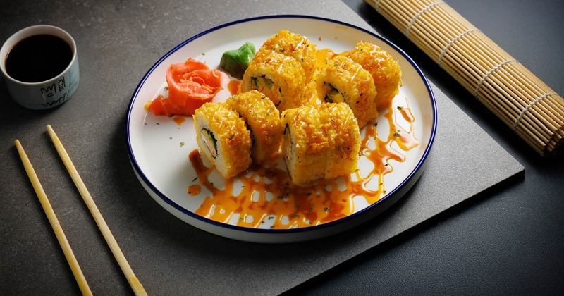 Fried sushi rolls served with pickled ginger, wasabi, and soy sauce