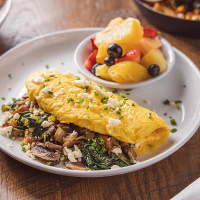 Build your own omelette variant served with fruit bowl