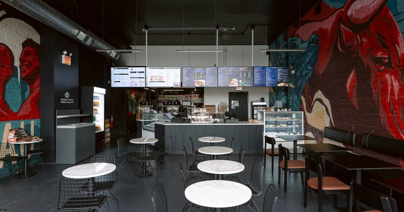 Restaurant counter with menu boards and seating