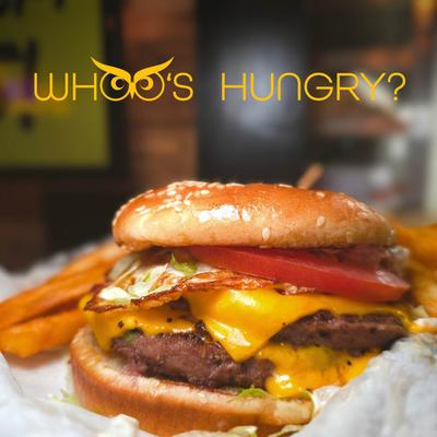 Double cheeseburger with fries, closeup.