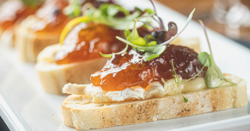 Close up of Brie & Fig Crostini on a white plate