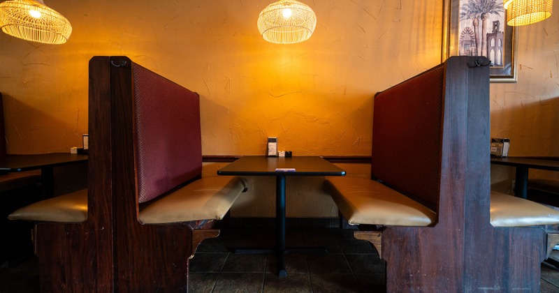 Interior, booths with tables near the wall