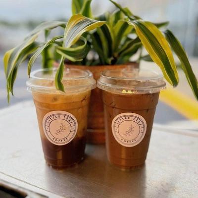 Drinks and a plant on the table.