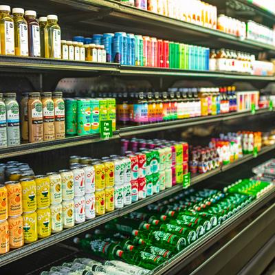 Shelves filled with bottled and canned beverages.