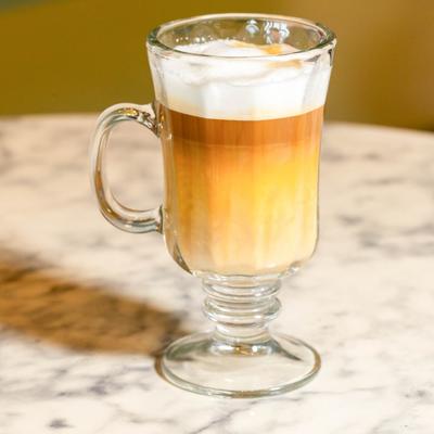 Latte macchiato served in a glass.