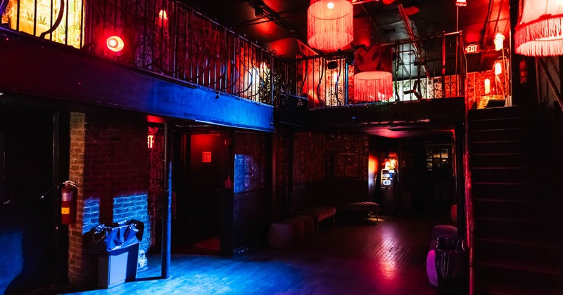 Interior, a dimly lit room with red and blue lights