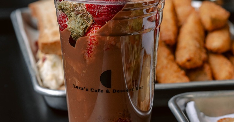 Chocolate milkshake topped with fresh strawberries