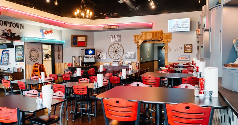 Spacious and cozy interior dining area, dining tables ready for guests