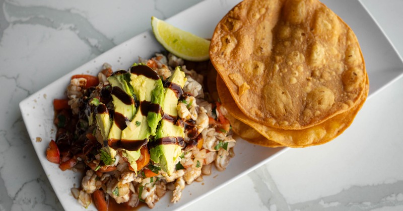 Shrimp ceviche served with tostadas on a plate