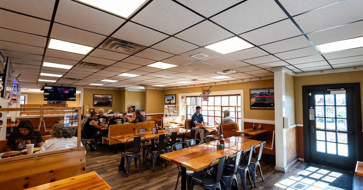 Interior, dining area, guests sitting and chatting