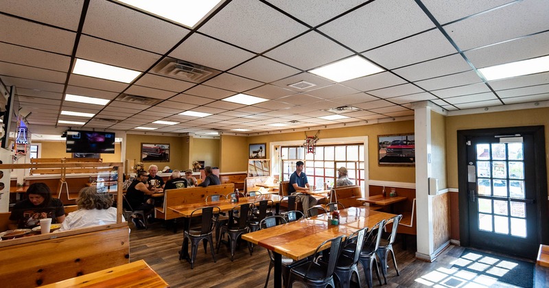 Interior, dining area, guests sitting and chatting