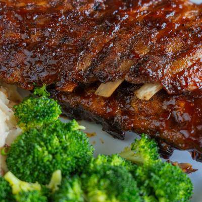 Baby Back Ribs and broccoli, close up.