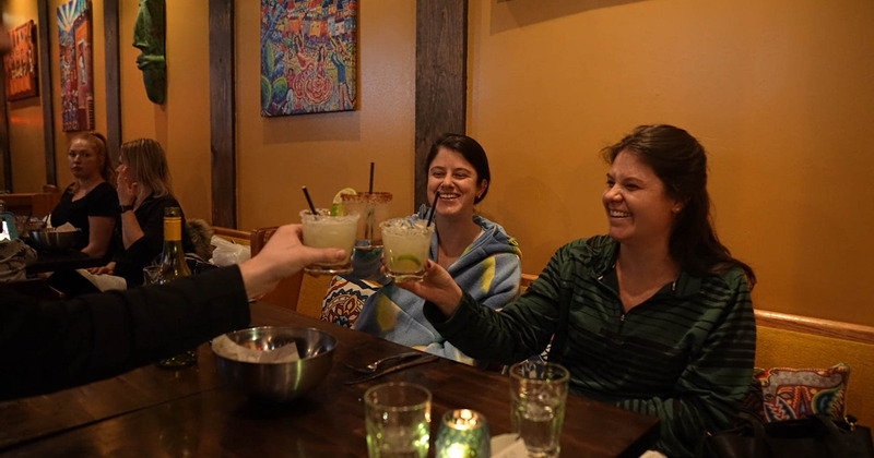 Guests toasting with cocktails