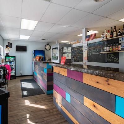 Interior, bar, cash register counter, seating.
